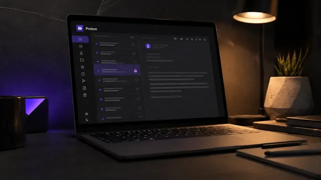 A private Proton inbox open on a laptop in a dark workspace