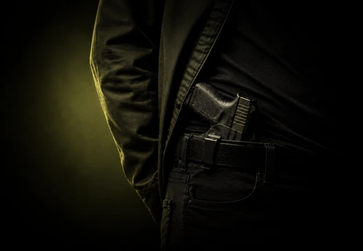 Concealed carry holster and handgun at the waistband
